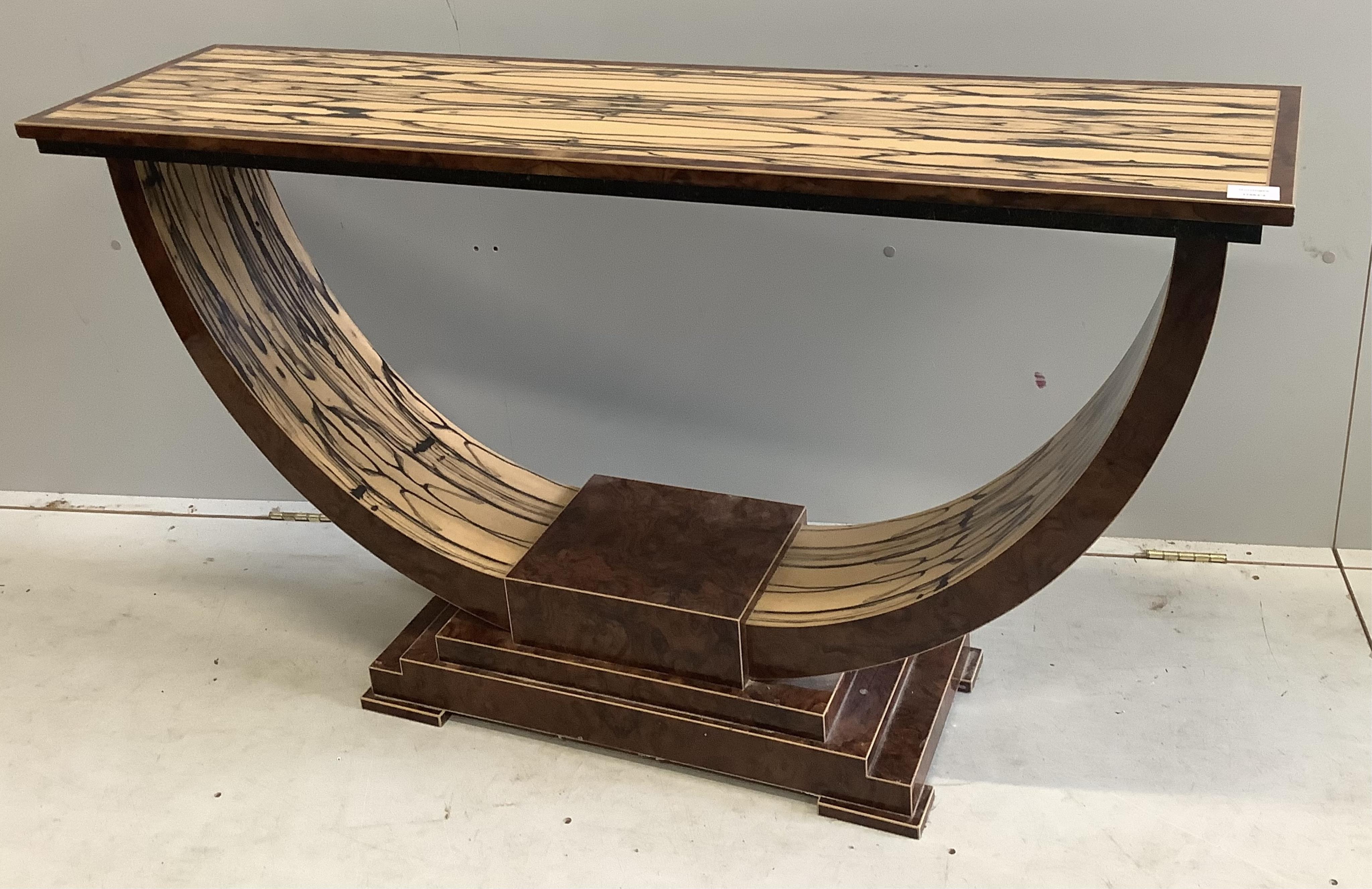An Art Deco style white ebony and walnut console table